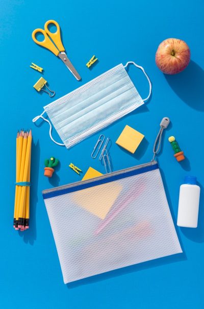 top-view-school-supplies-with-medical-mask-apple_23-2148575174